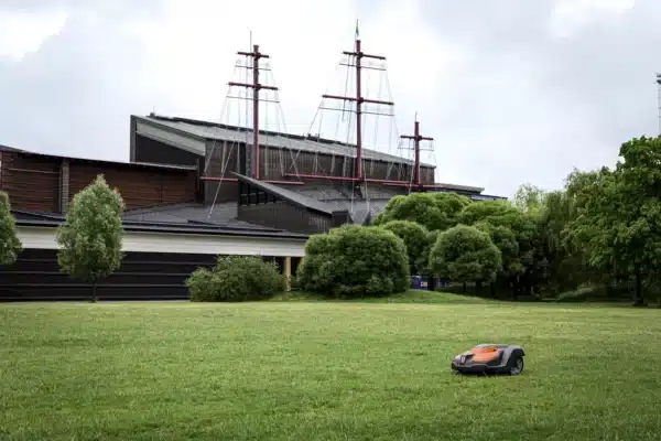 Robot mower by Husqvarna mowing commercial green space