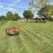 Husqvarna 550 EPOS mowing in straight lines to create a stripes lawn